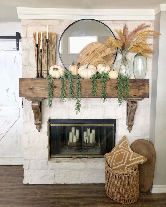 12 Creative Fall Mantels - love this neutral rustic fall mantel natural elements kellyelko.com #fall #falldecor #falldecorating #fallmantel #farmhousedecor #farmhousestyle #mantels #eclecticstyle #neutraldecor #pumpkindecor 