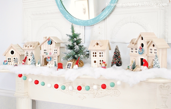 These adorable bird houses get a Christmas makeover kellyelko.com #christmasdecor #diychristmas #christmasdiy #christmasmantel #christmasdecorating #birdhouse #christmascrafts #kidschristmas #kellyelko