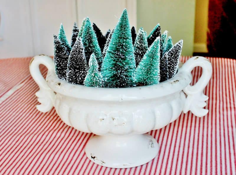 Creative Bottle Brush Tree Ideas - love this urn filled with a forest of little trees #vintagechristmas #christmasdecor #christmastrees #bottlebrushtrees