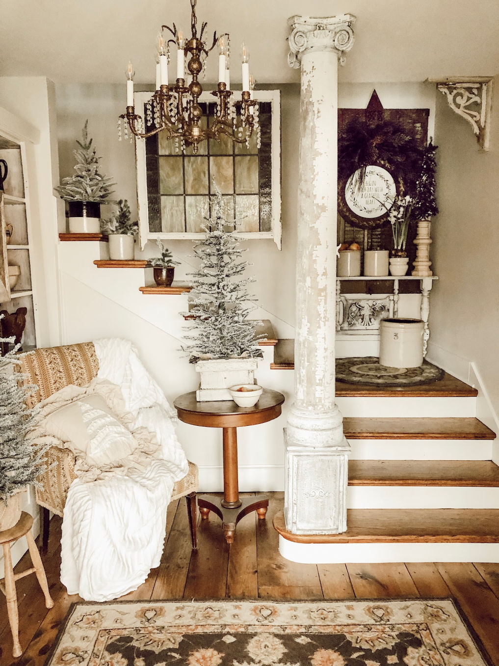 Farmhouse entry decorated for Christmas with mini trees in vintage crocks #christmastree #vintagechristmas #farmhousechristmas #farmhouse #entry #vintagedecor #neutraldecor