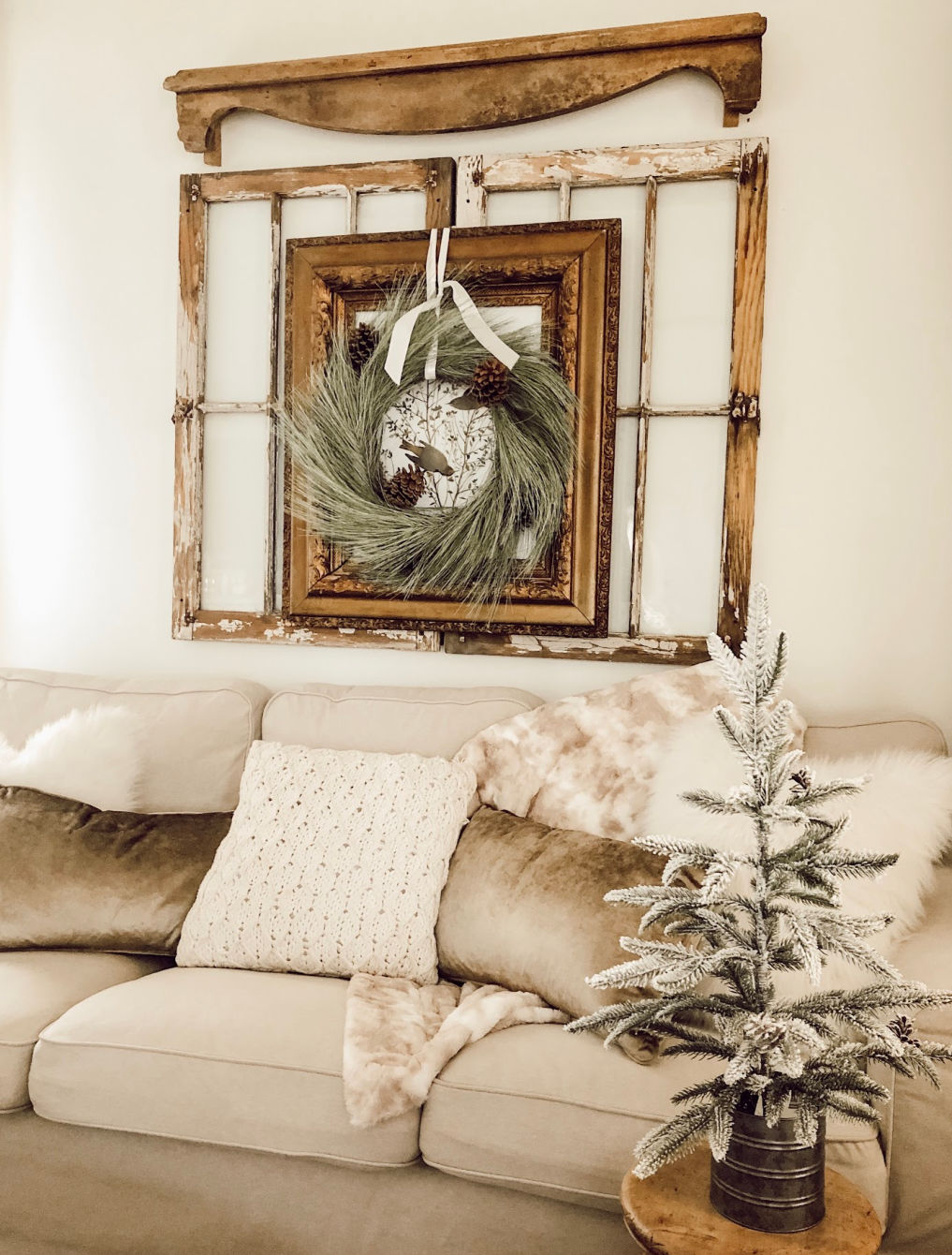 Old windows are the perfect backdrop to art or a wreath #farmhouse #farmhousedecor #farmhousestyle #neutraldecor #cottagestyle #christmaswreath #farmhousechristmas
