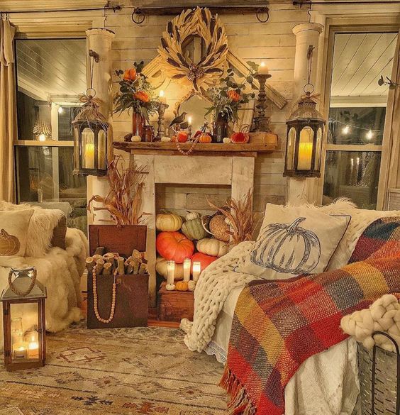 Faux fireplace filled with pumpkins for fall kellyelko.com #falldecor #fallfamilyroom #farmhousedecor #farmhouse #farmhousestyle #pumpkins #cozyhome