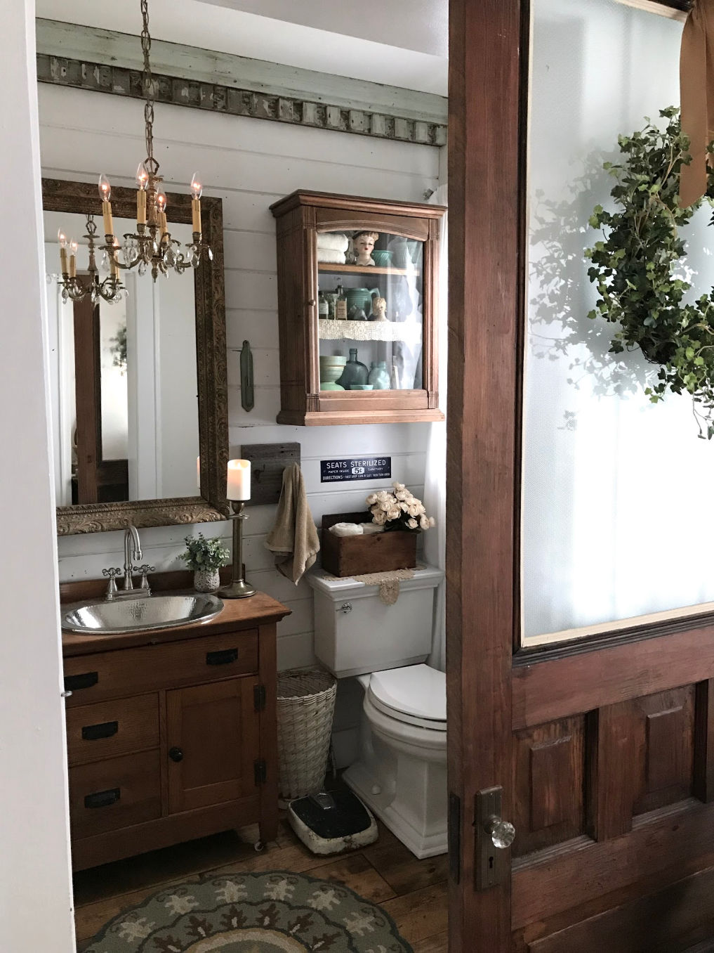 Farmhouse bathroom with old cabinet turned vanity #bathroom #powderroom #shiplap #farmhousebathroom #farmhousedecor #vintagedecor 