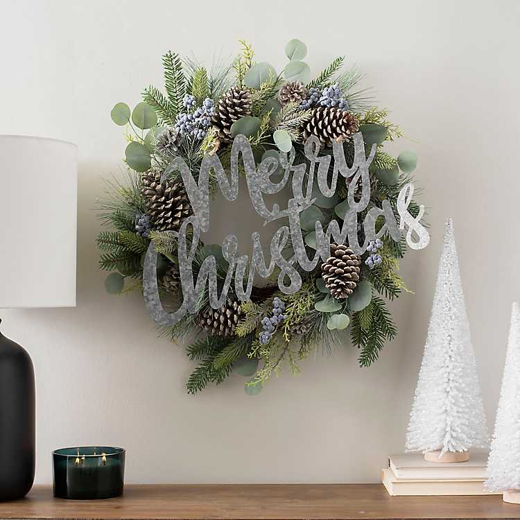 Add a galvanized metal sign to a plain wreath to turn it into a farmhouse Christmas wreath kellyelko.com #christmas #christmasdecor #diychristmas #christmaswreath #vintagechristmas 