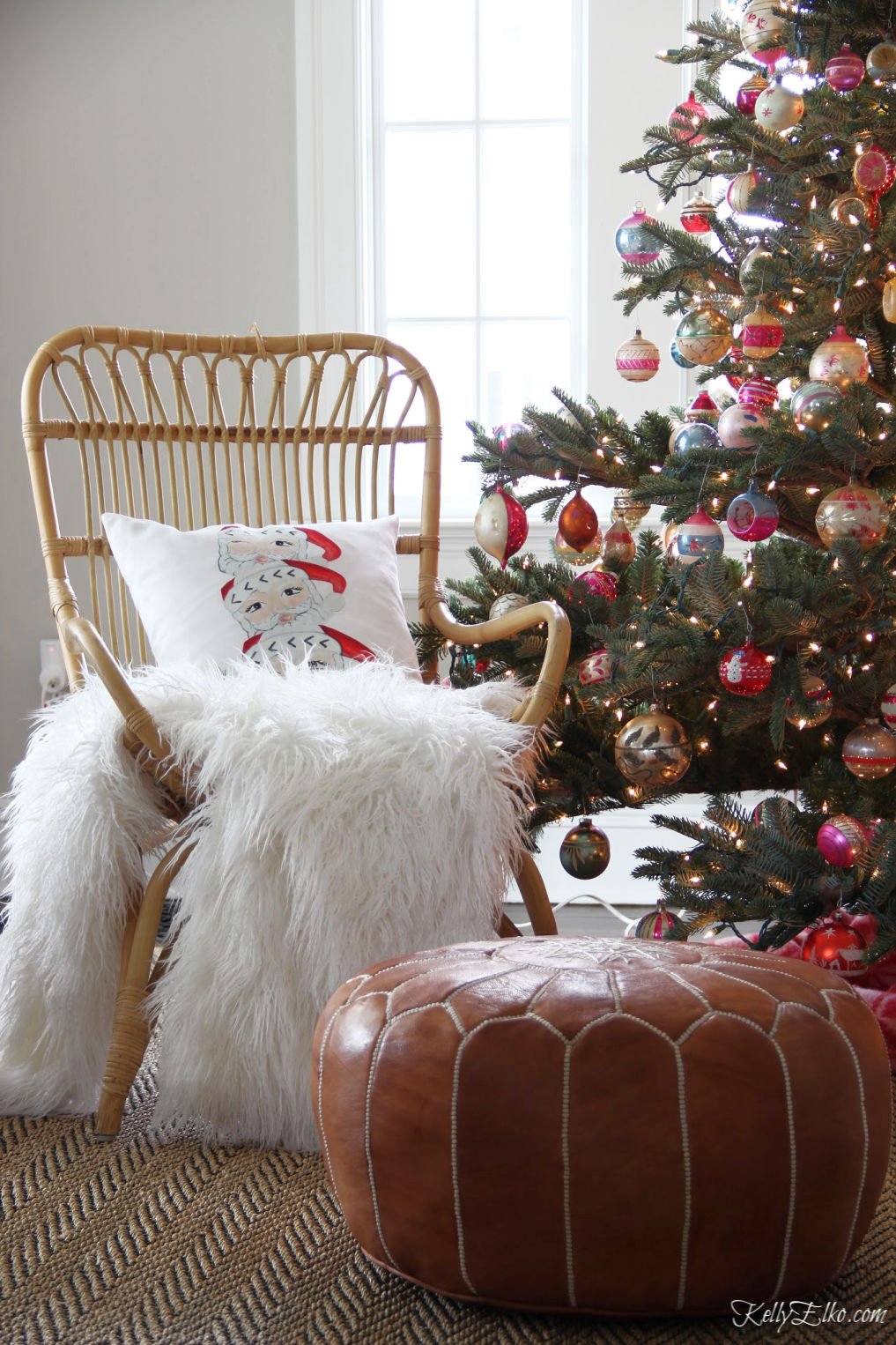 This vintage Santa mug pillow is so cute next to a Christmas tree filled with old Shiny Brites kellyelko.com #christmas #santa #vintagechristmas #bohochristmas #vintagedecor #vintagemodern #christmasdecor #christmaspillows #christmasornaments #kellyelko