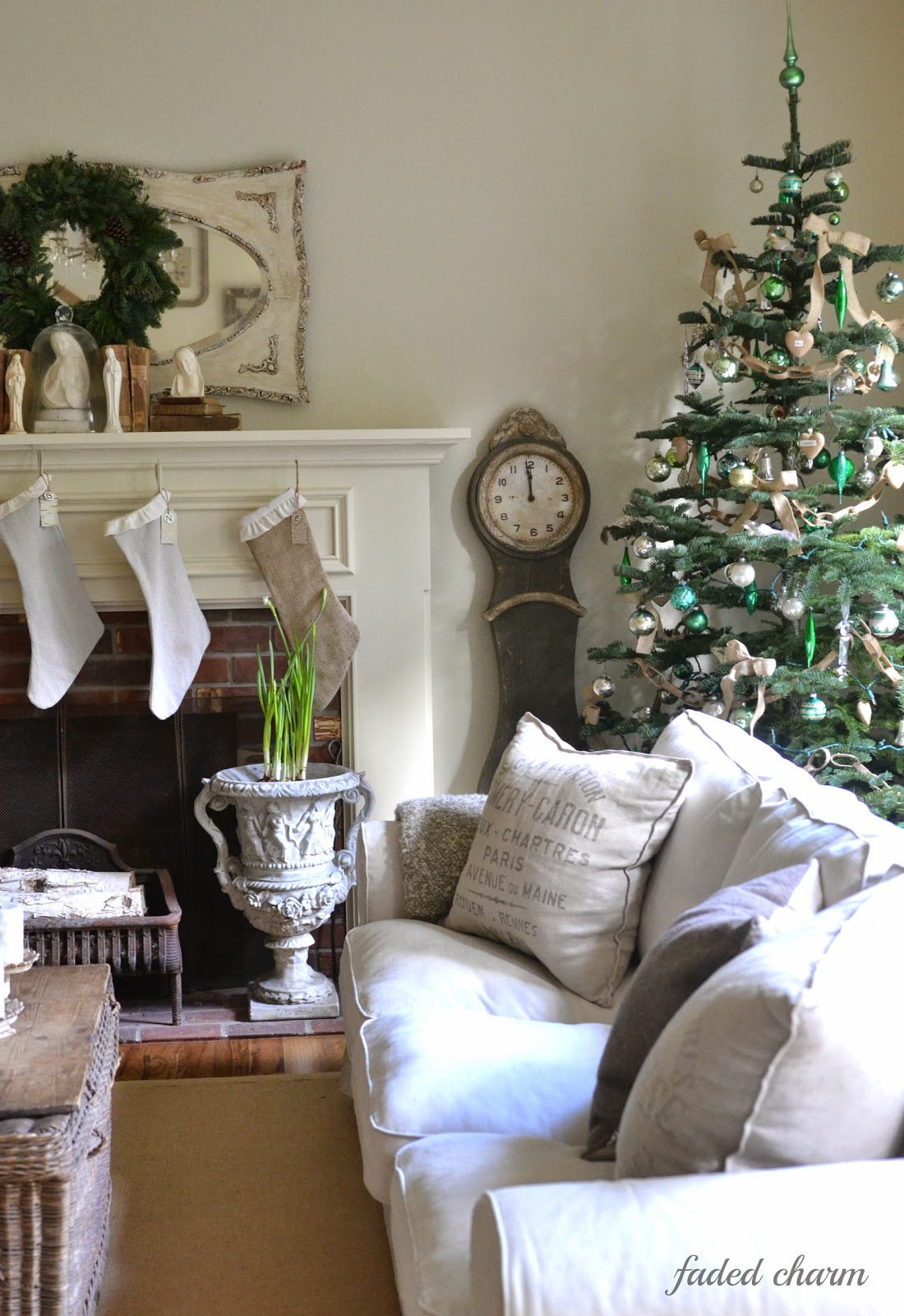 15 Sparse Christmas Trees - love this beautiful tree with green and silver vintage ornaments kellyelko.com #christmas #christmastree #sparsechristmastree #vintagechristmas #christmasdecor #christmasedecorating #christmasdecoratingideas #farmhousechristmas #christmasornaments #neutralchristmas #silvertip #kellyelko