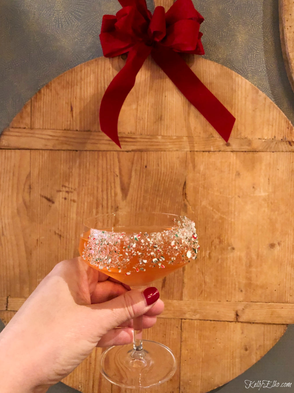 Christmas Cocktail with crushed candy cane rim! kellyelko.com #cocktails #drinks #happyhour #partydrinks #candycane