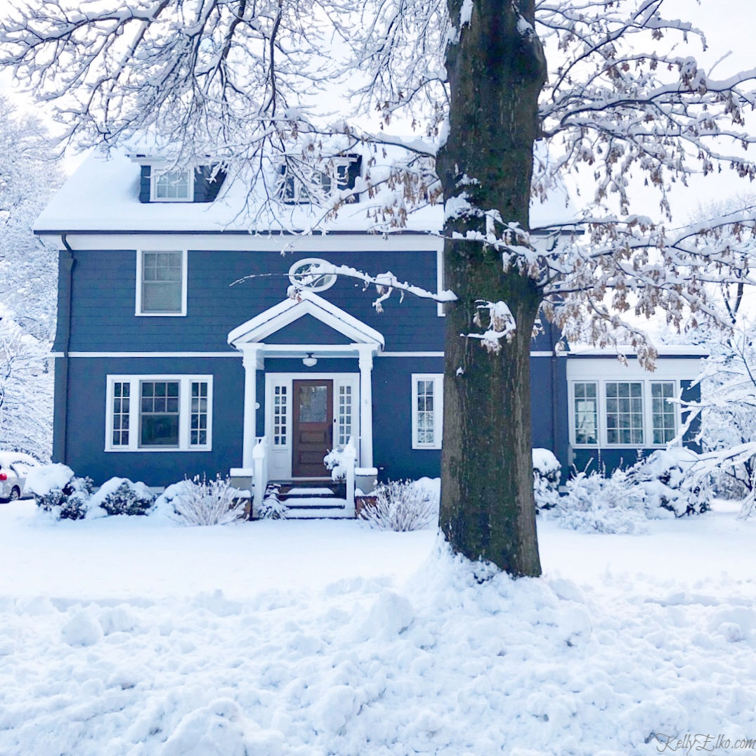 This blue house color really pops against the freshly fallen snow kellyelko.com #bluehouse #bluepaint #oldhouse #oldhome #curbappeal #snow #farmhouse #winterwonderland 