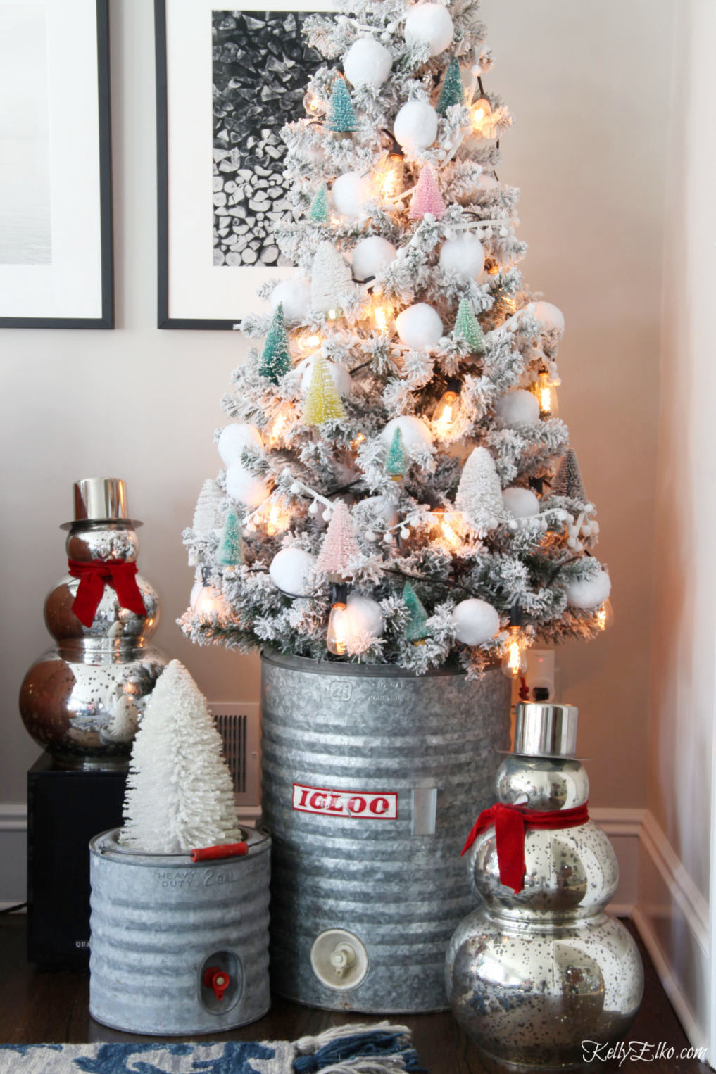 Creative Christmas Home Tour - love this flocked tree with bottle brush tree and snowball ornaments kellyelko.com #christmas #christmasdecor #christmasdecorating #christmashome #christmastour #diychristmas #christmasideas #christmasmantel #christmastree #christmasornaments #vintagechristmas #farmhousechristmas #colorfulchristmas #creativechristmas #kellyelko #galvanized #vintagedecor #christmascrafts #diychristmas #kidschristmas 