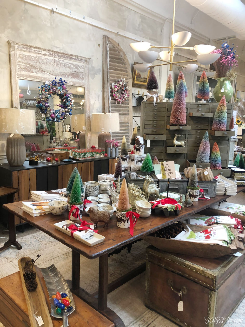 Get creative Christmas decorating ideas from local shops - love the bottle brush trees and vintage ornament wreaths kellyelko.com #christmasdecor #christmasdecoratingideas #vintagechristmas #christmastrees 