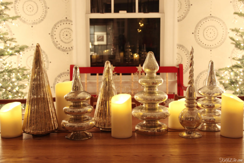 Christmas centerpiece of mercury glass trees and candles kellyelko.com #christmasdecor #christmascenterpiece #wintercenterpiece #christmastable #wintertable #mercuryglass #farmhousestyle #farmhousechristmas #fixerupperstyle #kellyelko