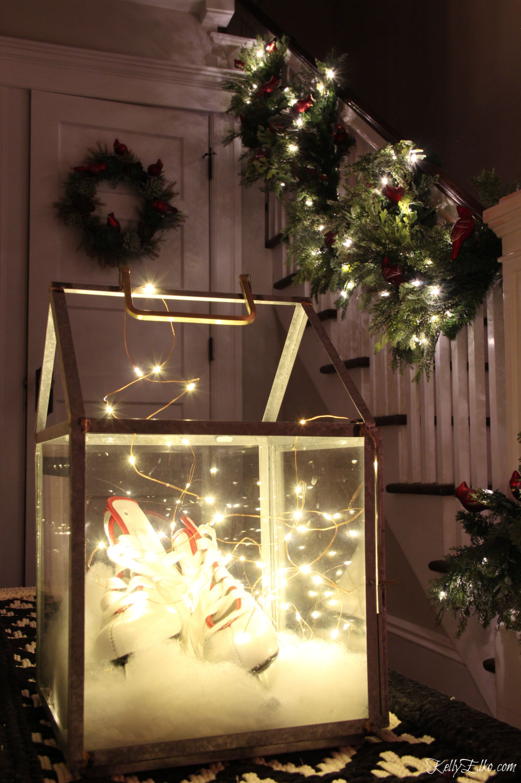 Christmas Night Tour - love the lantern filled with an old pair of ice skates and fairy lights kellyelko.com #christmasdecor #christmasfoyer #christmaslights #fairylights #vintagedecor #vintagechristmas #farmhousechristmas #kellyelko