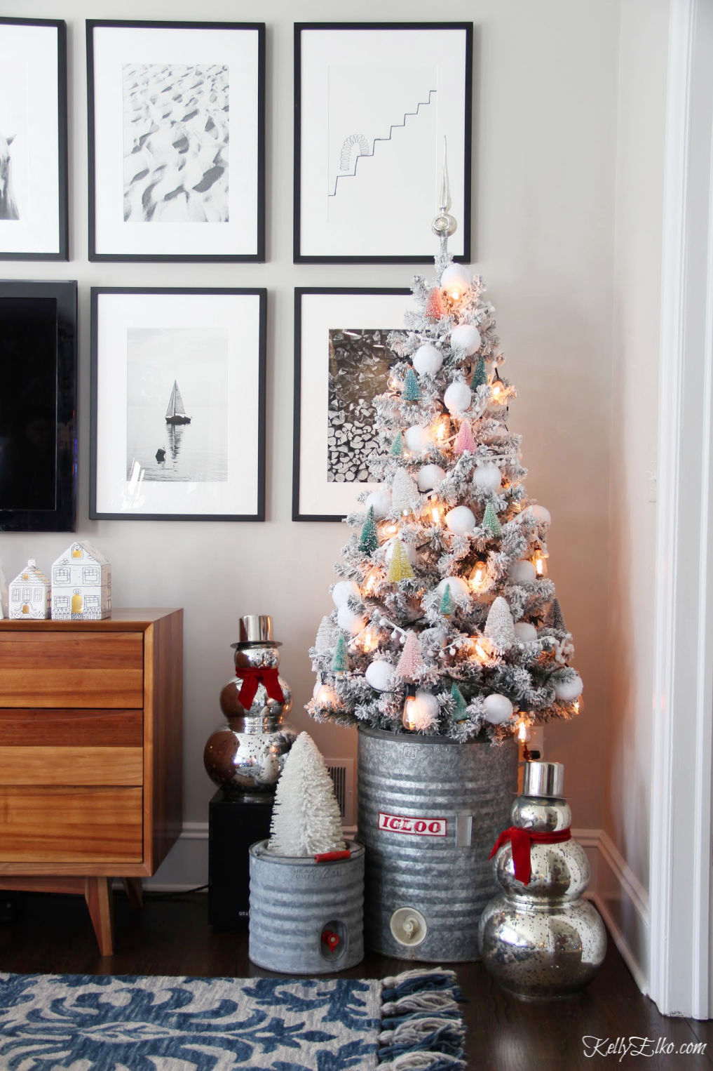 Creative Christmas Home Tour with tons of DIY and decorating ideas like this flocked tree with bottle brush tree ornaments kellyelko.com #christmas #christmasdecor #christmasdecorating #christmashome #christmastour #diychristmas #christmasideas #christmasmantel #christmastree #christmasornaments #vintagechristmas #farmhousechristmas #colorfulchristmas #creativechristmas #kellyelko #bottlebrushtrees #vintagedecor #repurpose #upcycle #mercuryglass