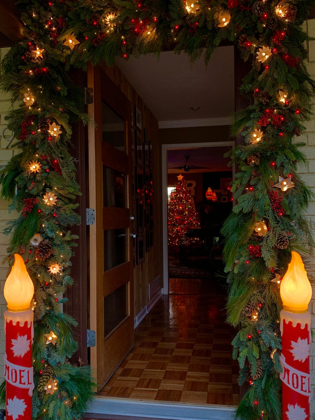 Beautiful porch with garland and vintage candle blow molds #vintage #vintagecollections #vintagechristmas #vintagecollectibles #collections #collectibles #collector #christmaslights #blowmolds 