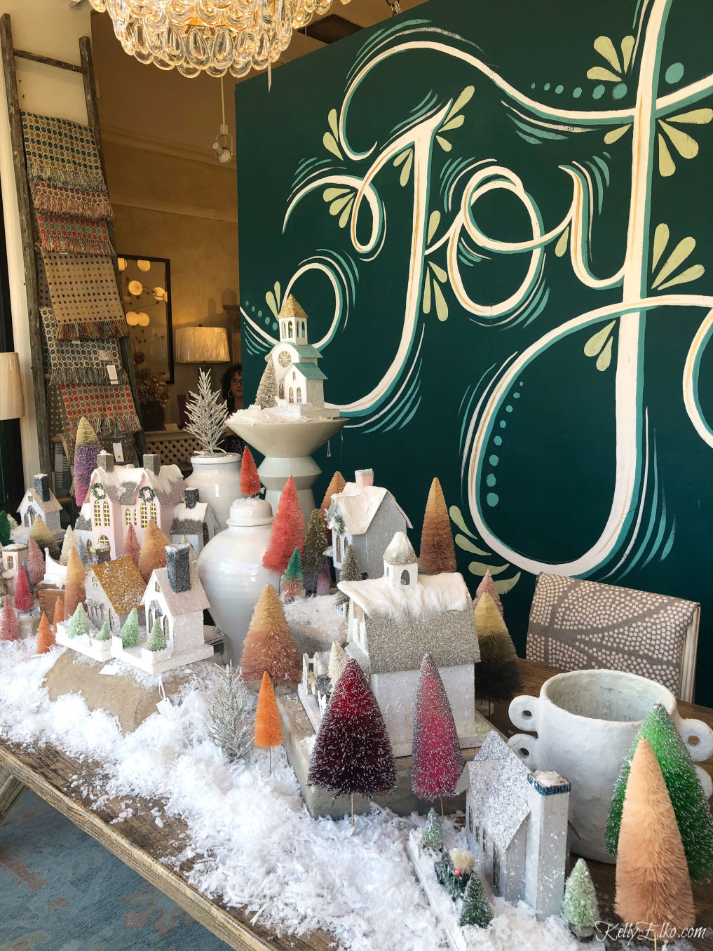 Love this winter village of paper houses and bottle brush trees kellyelko.com #joy #christmasdecor #christmastable #christmascenterpiece #vintagechristmas #putzhouses #christmastrees #kellyelko