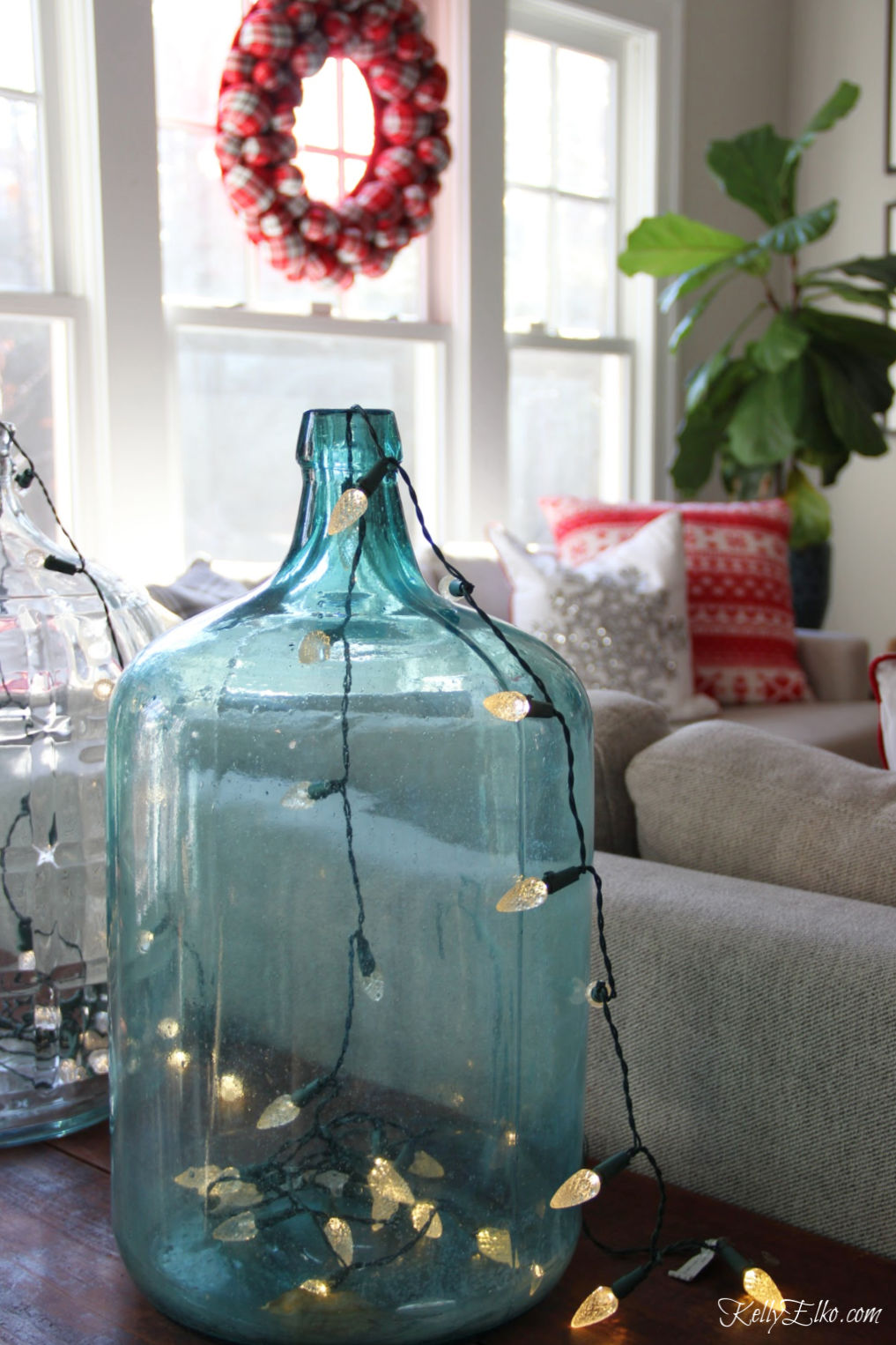 Christmas Home Tour - love this old glass jar filled with string lights kellyelko.com #christmas #christmasdecor #christmasdecorating #christmashome #christmastour #diychristmas #christmasideas #christmasmantel #christmastree #christmasornaments #vintagechristmas #farmhousechristmas #colorfulchristmas #creativechristmas #kellyelko #christmaslights #diychristmas