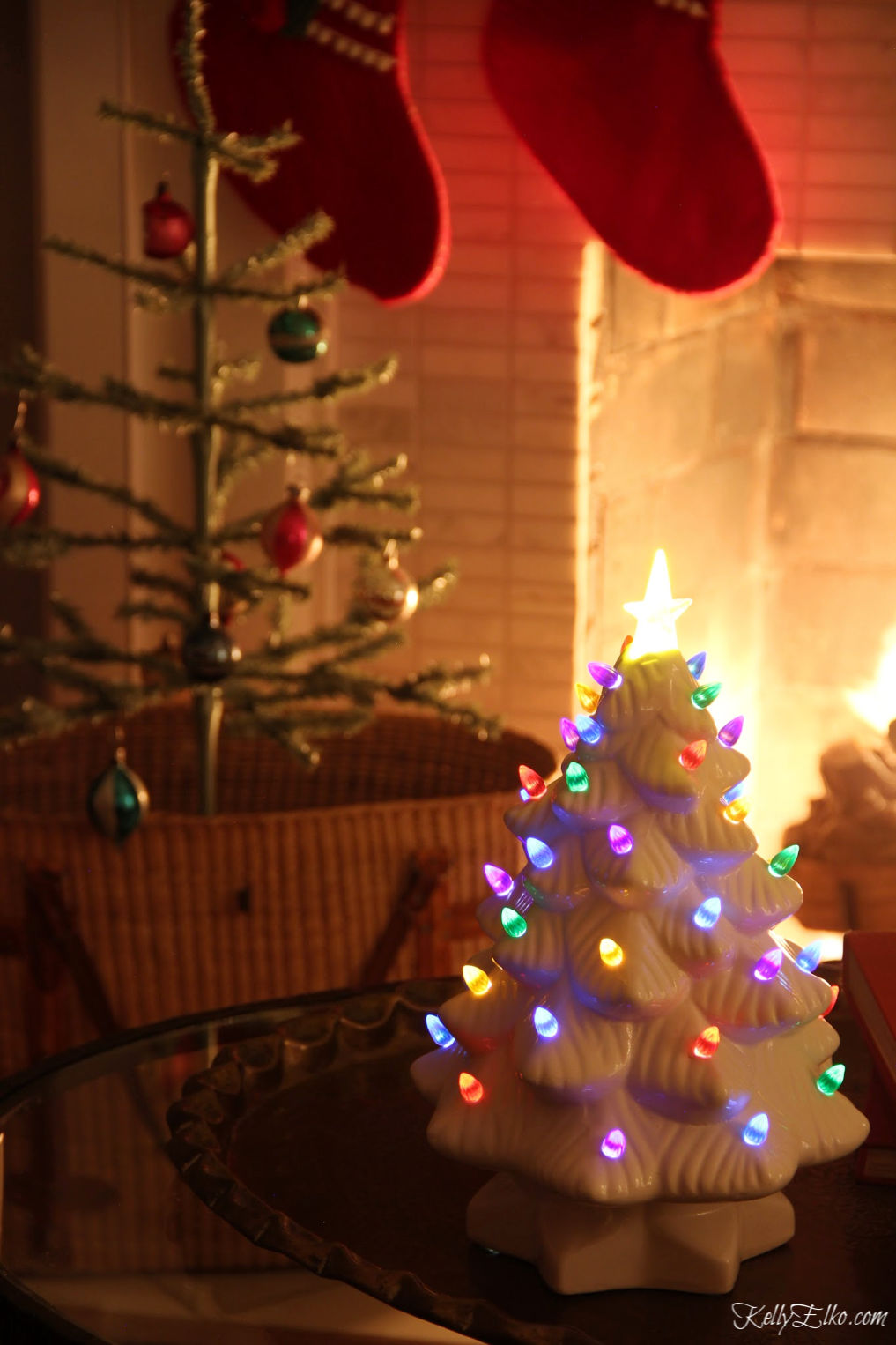 Love this vintage inspired ceramic light up Christmas tree kellyelko.com #christmasdecor #christmastree #vintagechristmas #feathertree #farmhousechristmas #cozychristmas #christmasnightstour #kellyelko