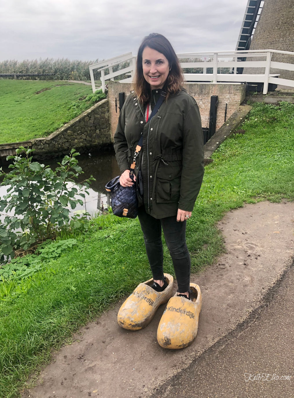 A fun pair of giant wooden shoes at Kinderdijk windmills kellyelko.com #kinderdijk #unescosite #windmills #woodenshoes #travelblog #travelblogger #kellyelko