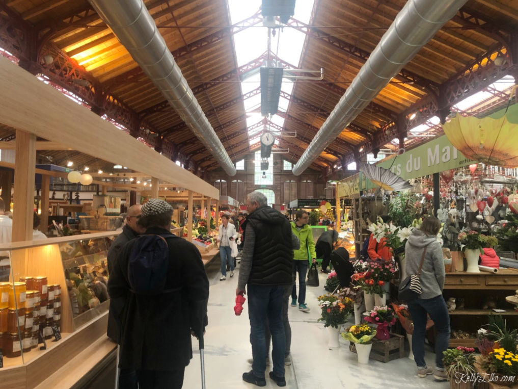 Visit the Marche Couvert or covered market in Colmar France for great food, flowers, drinks, gifts and more kellyelko.com #colmar #colmarfrance #foodmarket #travel #france #rhineriver #rivercruise 