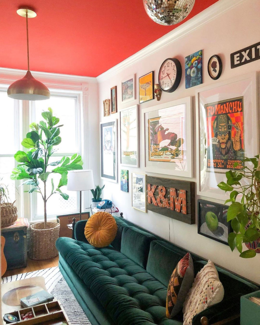 Love this colorful room with red ceiling, blue velvet sofa and eclectic gallery wall #gallerywall #velvetsofa #paintedceiling #colorfuldecor #colorlovers #eclecticdecor #vintagedecor #fiddleleaffig #bohodecor #redpaint #discoball #art #housetour