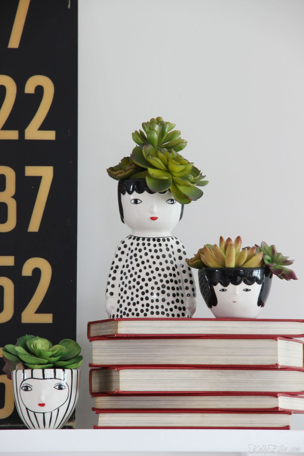 Love this trio of face planters filled with succulents for hair kellyelko.com #succulents #plantlady #houseplants #faceplanters #headplanter #planters #uniqueplanter #blackandwhite #kellyelko