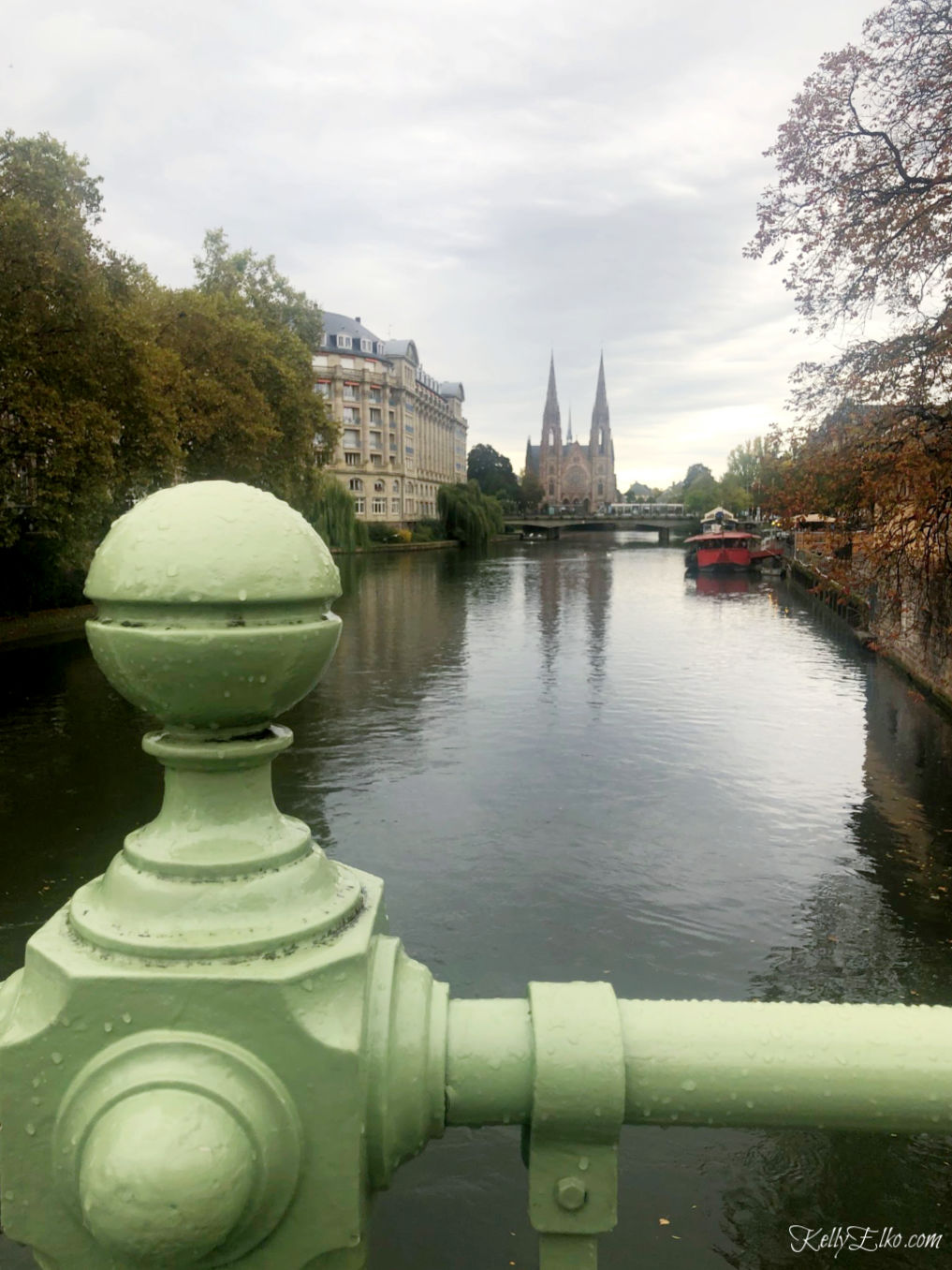 Strasbourg Cathedral from a bridge across the canal kellyelko.com #strasbourg #strasbourgcathedral #cathederal #rivercruise #luxurytravel #france #exploreeurope #travelblog #travelblogger 