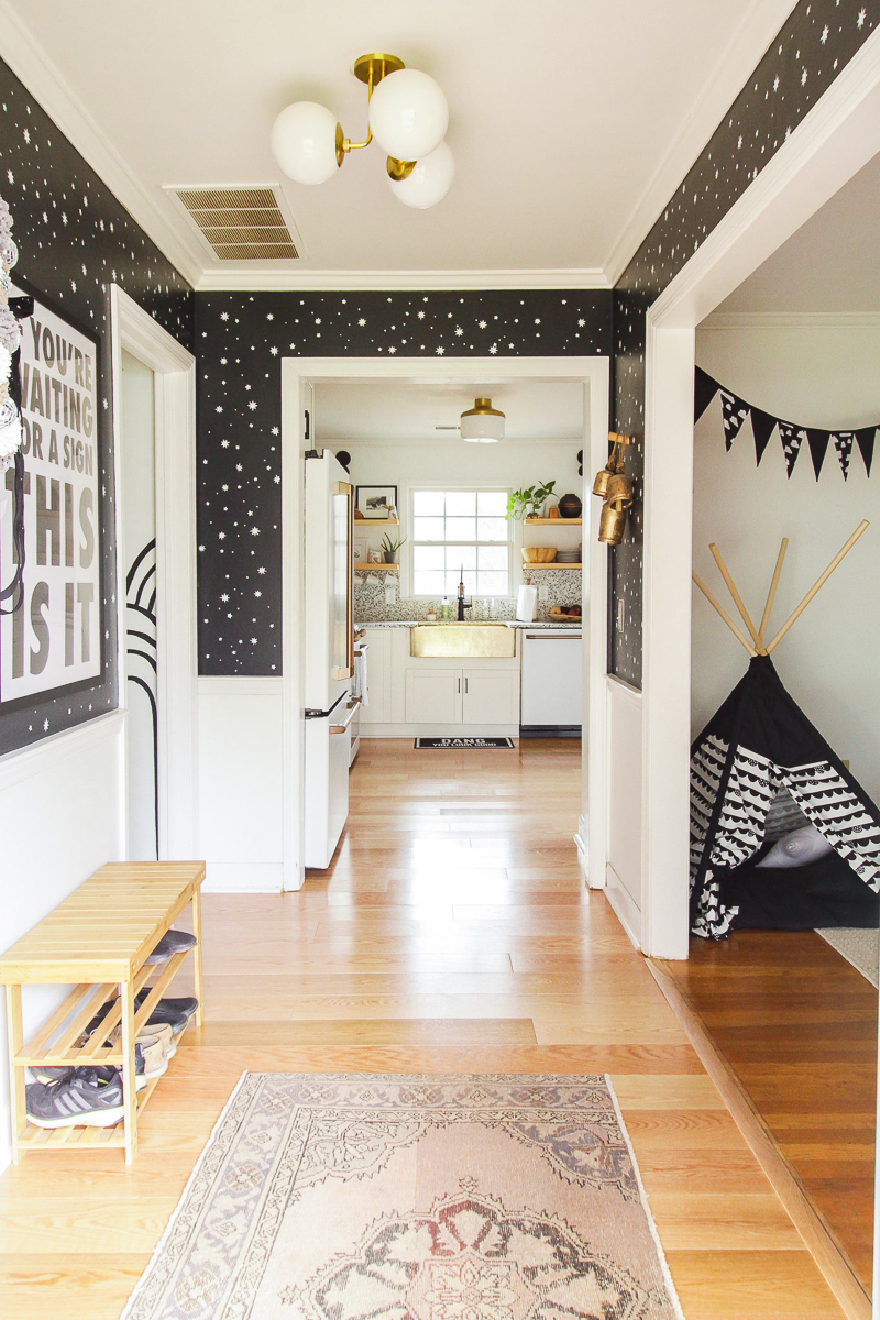 Love this foyer with black and white graphic wallpaper 