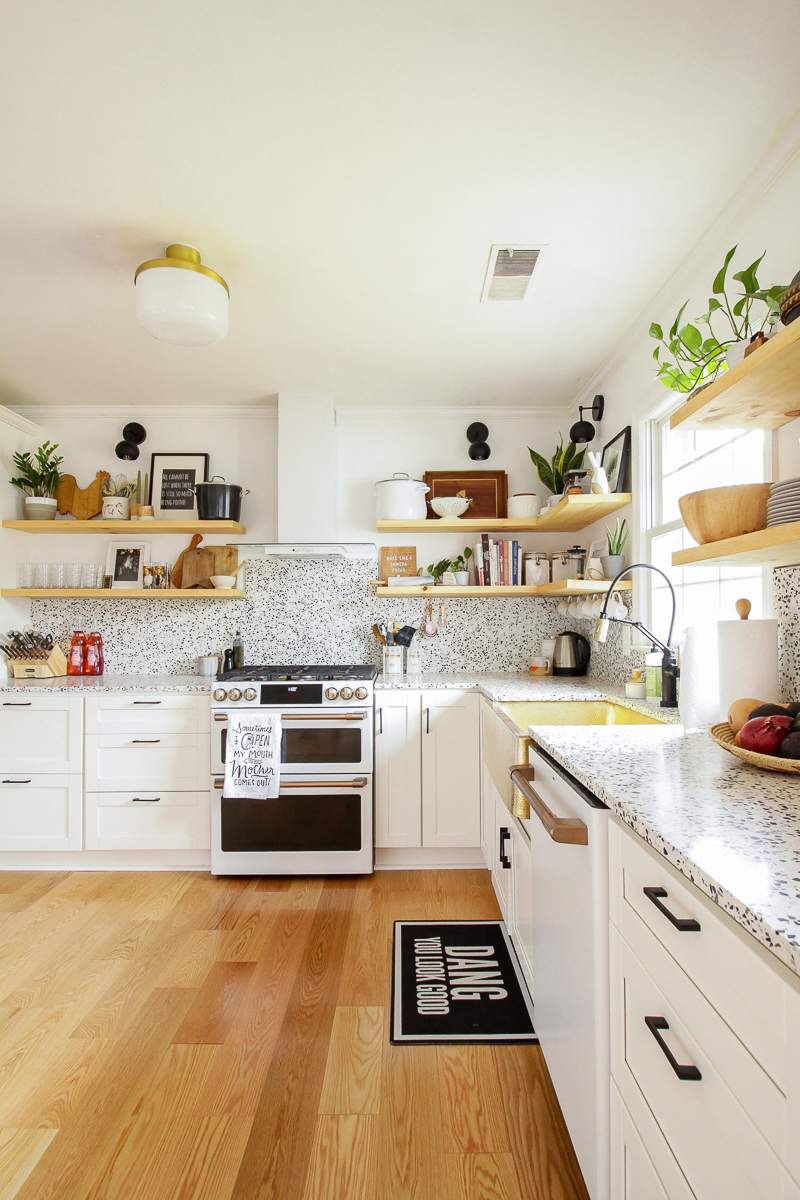 Gorgeous modern kitchen with terrazzo counters and open shelves 