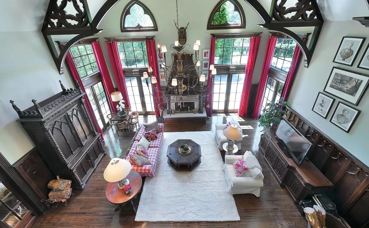 Great room with stunning wood arches and beams #greatroom #familyroom #mantel #fireplace #arches #architecture 