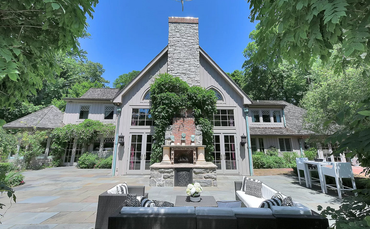 Beautiful bluestone patio with outdoor fireplace #bluestone #patio #backyard #outdoorfireplace #fireplace #climbingvines #landscaping 