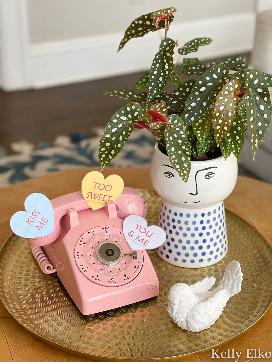 Fun little vintage Valentine decor with pink rotary phone and face planter kellyelko.com