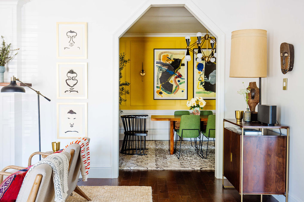 Tour this colorful, eclectic home with a vibrant yellow dining room #yellow #homedecor #eclecticdecor #diningroomdecor #colorful #bohodecor 