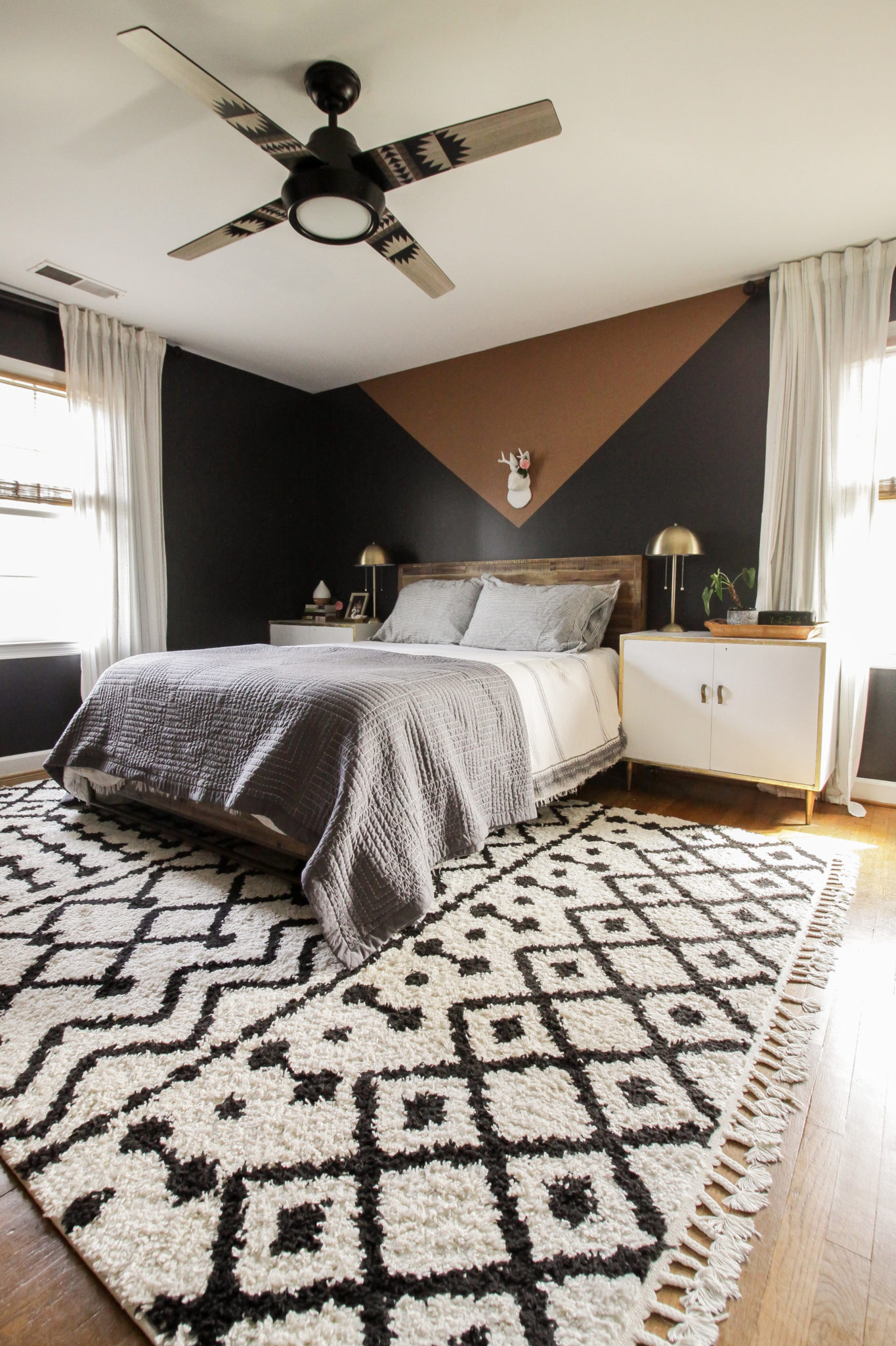 Cozy bedroom with black walls 