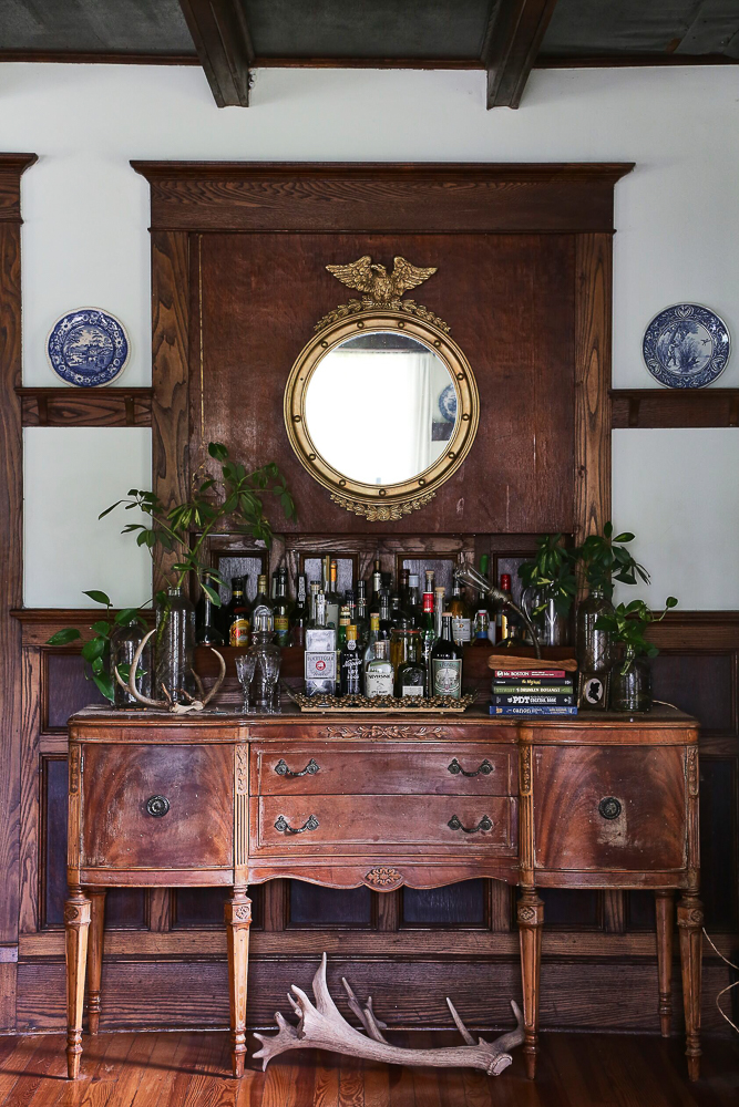 An antique buffet makes the perfect bar cart in this old farmhouse kellyelko.com #barcart #bar #cocktails #antiques #antiquefurniture #farmhouse #farmhousedecor #countryliving #traditionalhome 