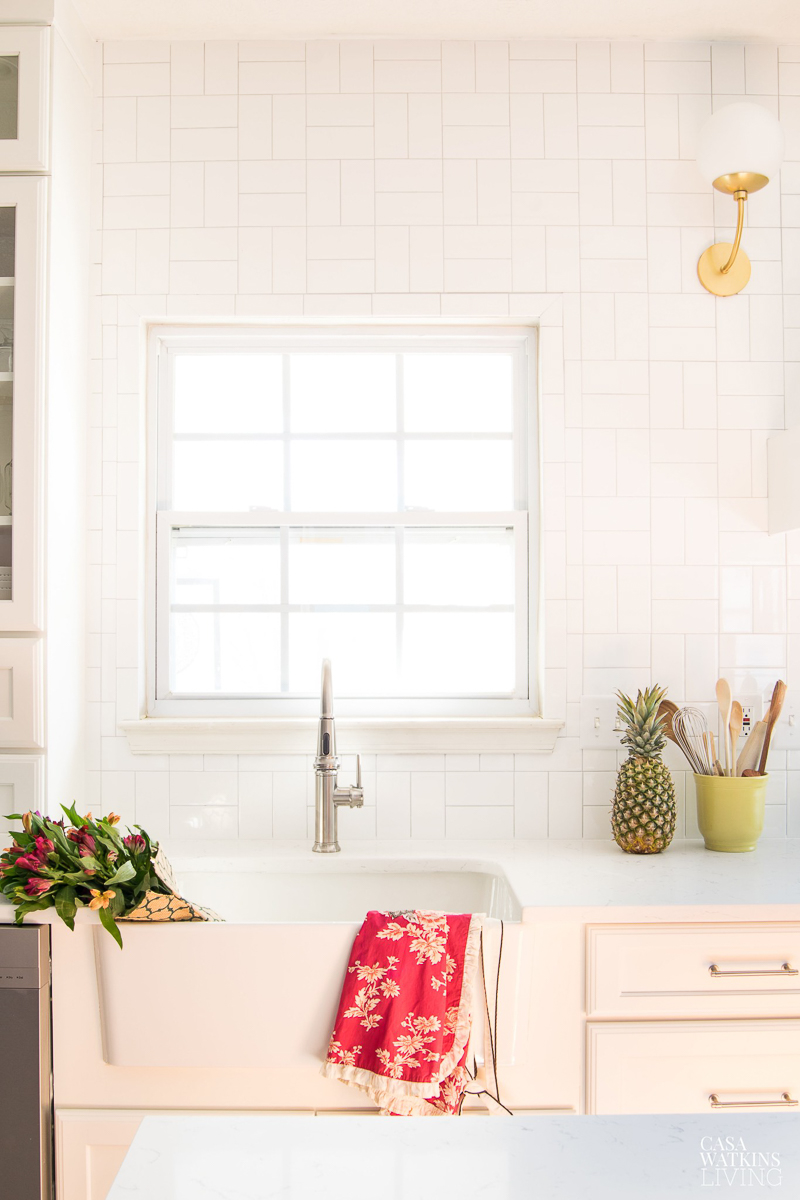 Hang subway tile in a square pattern for a unique look on a budget #kitchen #kitchentile #backsplash #subwaytile #kitchensink #farmhousesink #whitekitchen 