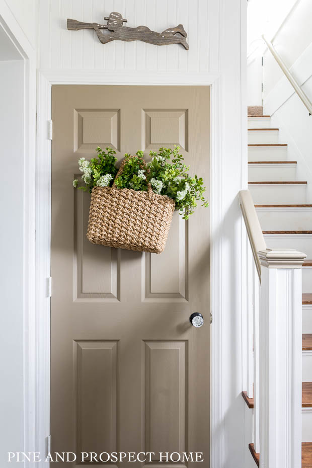 Paint a door for a fun pop of color #vintagedecor #foyer #entry #neutraldecor #painteddoor #farmhousedecor #basket #wallbasket 