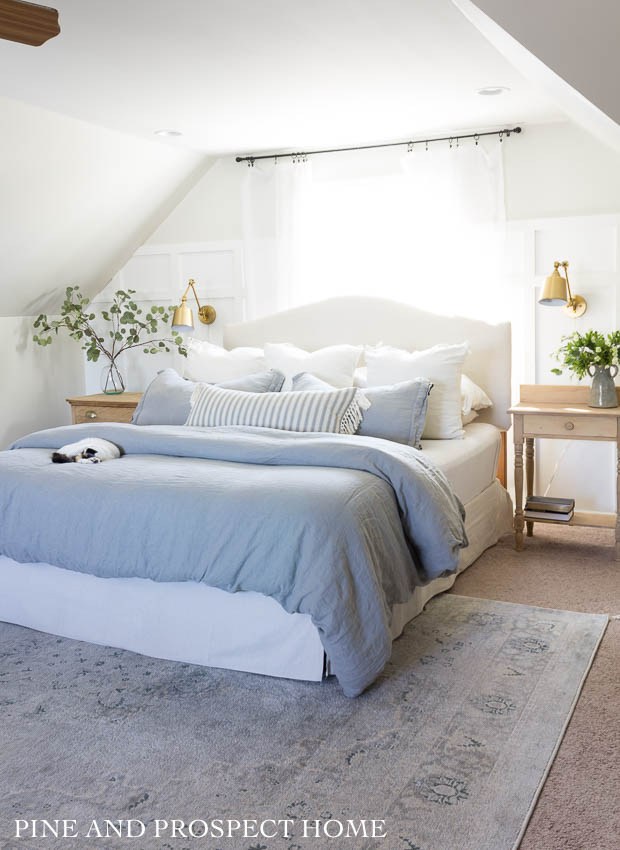 Cozy attic bedroom with board and batten walls #bedroom #bedroomdecor #atticbedroom #attic #farmhousedecor #farmhousebedroom 