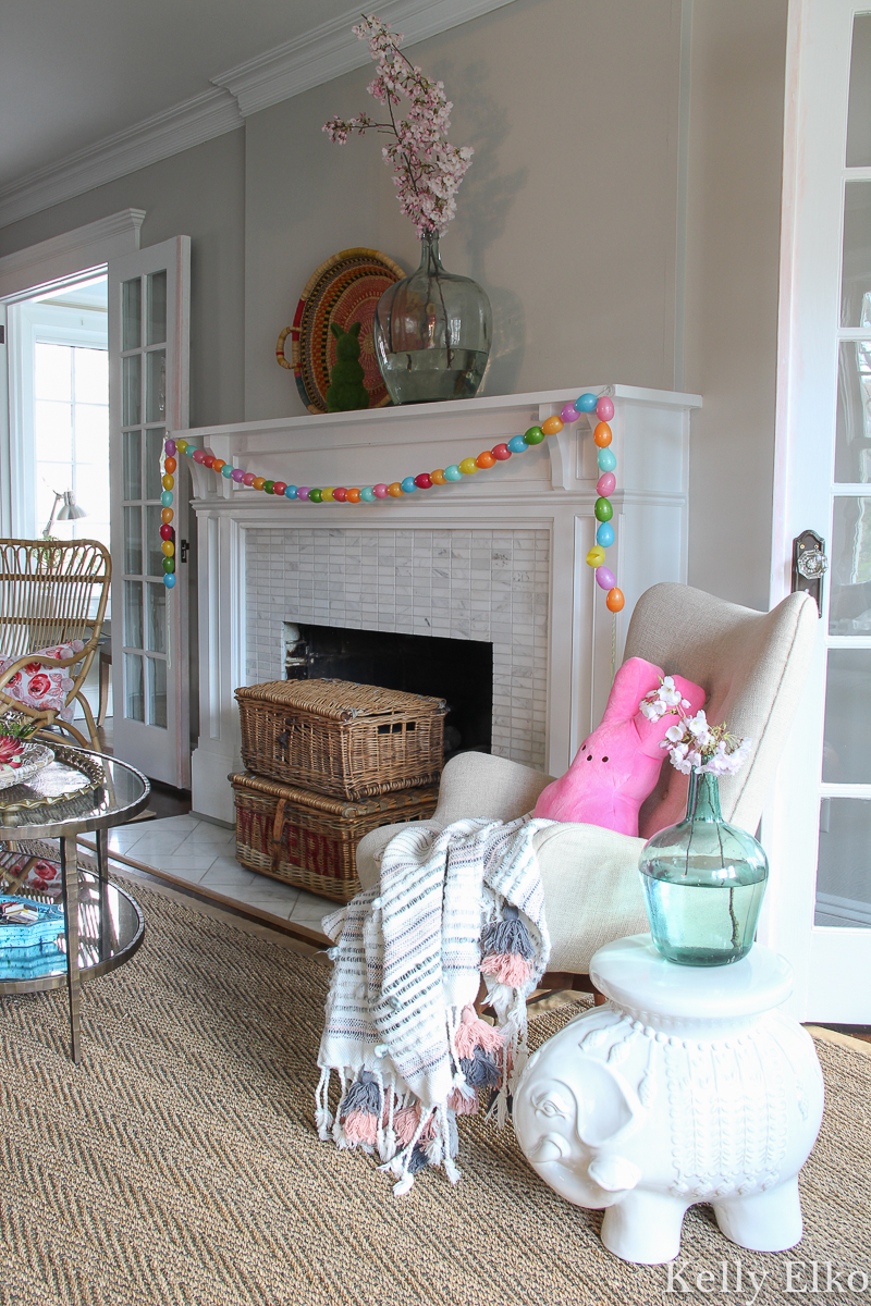 Spring mantel with egg garland and cherry blossom branches kellyelko.com