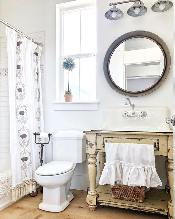 Cute farmhouse bathroom with vintage table turned vanity kellyelko.com #farmhouse #farmhousedecor #farmhousebathroom #diyvanity #diydecor #vintagedecor