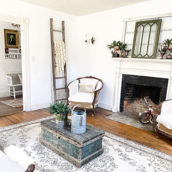 Love this charming farmhouse filled with vintage finds and the antique windows on the mantel #farmhouse #farmhousedecor #vintage #vintagedecor #antiques #mantel #manteldecor #neutraldecor #livingroomdecor #fixerupperstyle #homedecor #cottagestyle