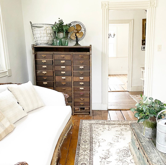 Charming farmhouse tour filled with unique antiques and vintage finds like these cubbies #antiques #vintage #vintagedecor #cubbies #farmhouse #farmhousedecor #neutraldecor #fixerupperstyle 