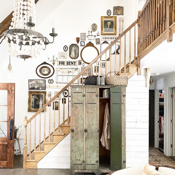 Eclectic Home Tour of The Little White Farmhouse - how amazing is that vintage gallery wall kellyelko.com #gallerywall #vintage #vintagedecor #farmhousedecor #foyerdecor #entrydecor #farmhousefoyer #farmhousestaircase #homedecor #shiplap 