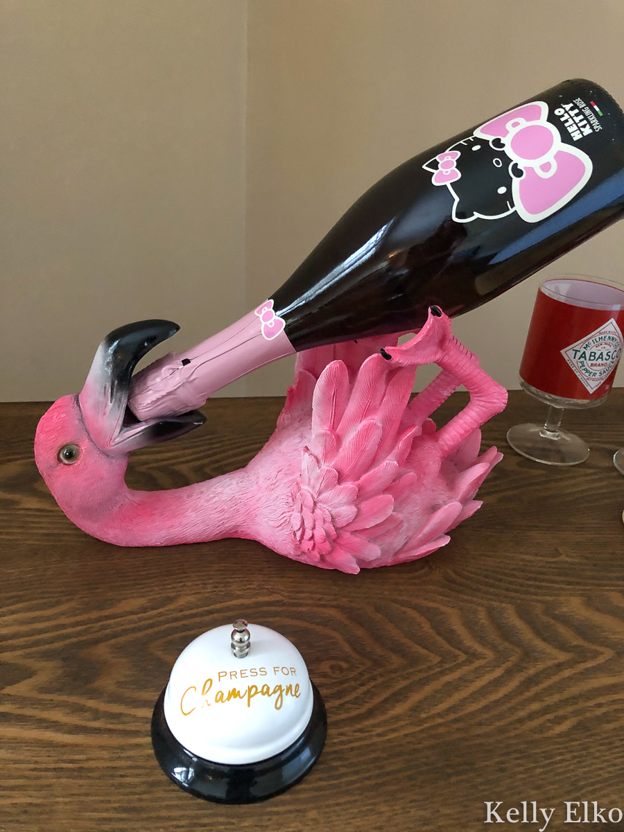 Weird pink flamingo bottle holder! kellyelko.com #flamingo #pinkflamingo #champagne #barcart