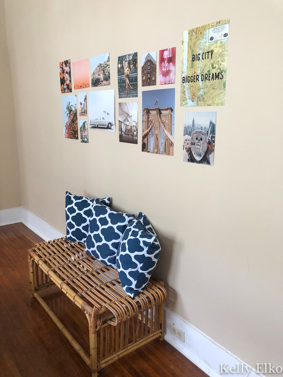 Love this instant gallery wall and cool rattan bench in this eclectic apartment done on a budget kellyelko.com #gallerywall #rattanfurniture #vintagedecor #vintagefurniture #collegeapartment #apartmentdecor #eclecticdecor #vintagemodern 