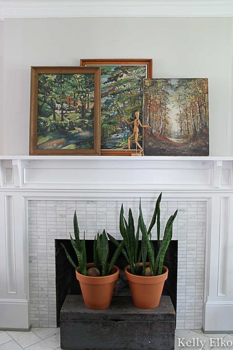 Fall mantel decorating ideas - I love the trio of vintage landscape paintings propped on the mantel kellyelko.com #fall #falldecor #fallmantel #vintagedecor #eclectic #art #vintageart #vintagepaintings #landscapepaintings #farmhousedecor #manteldecor