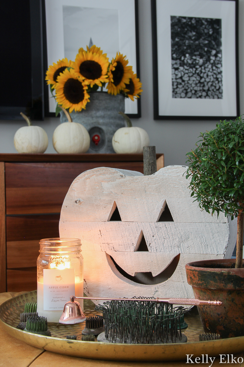 Love the vintage fall decor in this family room filled with unique collections like antique flower frogs and more kellyelko.com #fall #falldecor #falldecorating #sunflowers #pumpikindecor #farmhousedecor #vintagedecor #flowerfrogs #whitepumpkins 