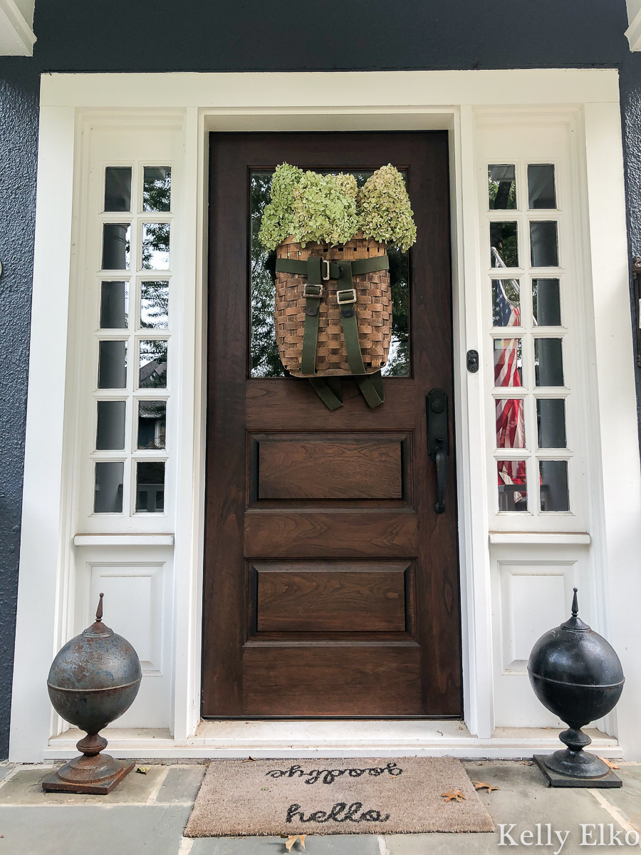 Love this basket wreath filled with hydrangeas kellyelko.com #basket #basketwreath #wreath #wreaths #fallwreath #summerwreath #curbappeal #diywreath #hydrangeas #limelight #vintagedecor #eclecticdecor #frontdoor #porch 