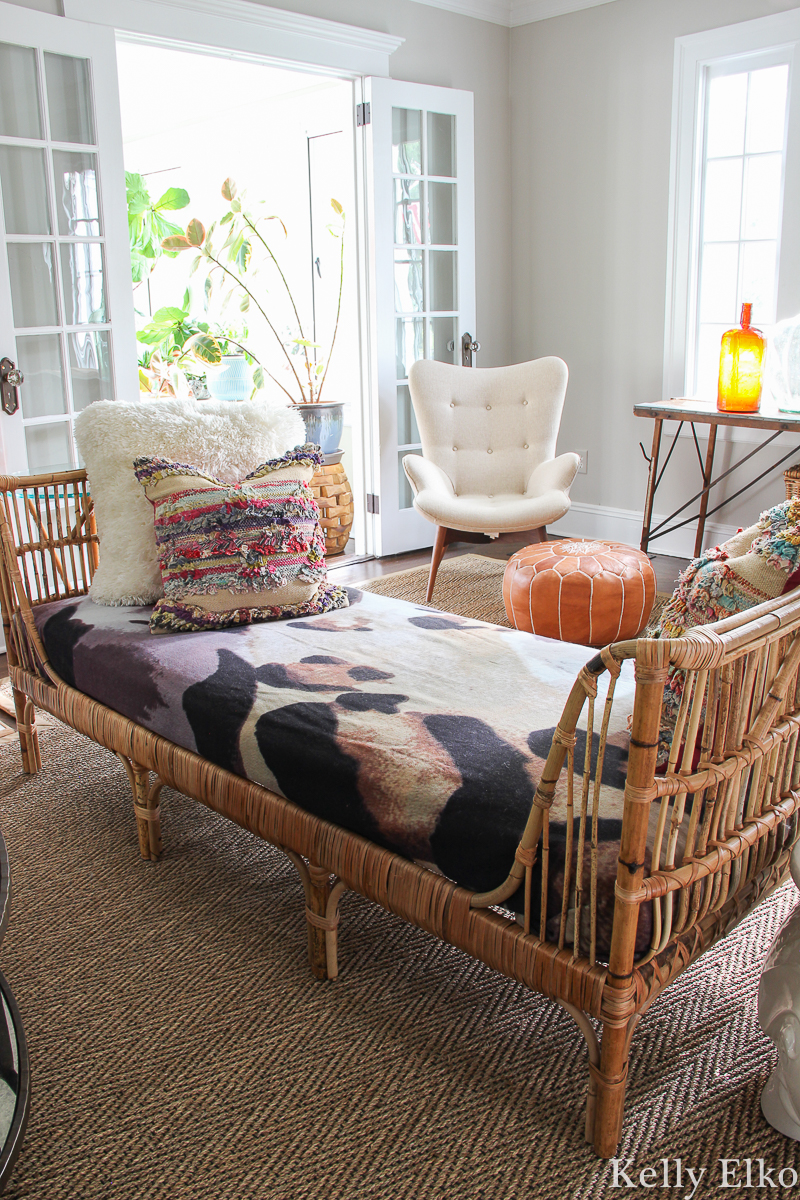 Love this eclectic living room with rattan daybed covered in leopard print kellyelko.com #leopoard #leopardprint #rattan #rattanfurniture #daybed #falldecor #livingroomfurniture #livingroomdecor #eclecticdecor #vintagedecor #falldecor