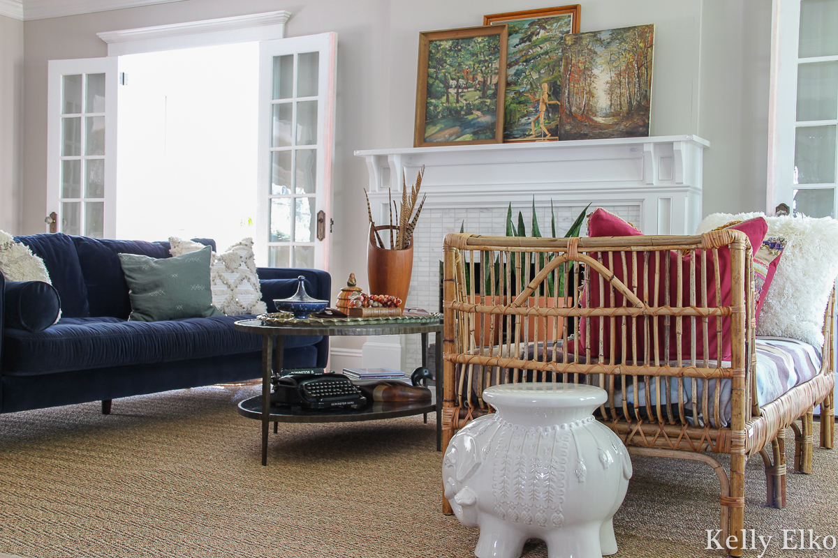 Vintage lovers fall living room filled with so many creative decorating ideas kellyelko.com #fall #fallhome #falldecor #fallhometour #fallivingroom #eclecticdecor #vintagedecor #vintagefall #vintagepaintings #vintagelandscapes #bohodecor #rattan #article #rattanfurniture #eclectic