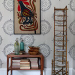 Love this beautiful antique bamboo plate rack and Danish modern bar cart in this eclectic dining room kellyelko.com #platerack #vintagedecor #danishmodern #barcart #bamboo #vintagebamboo #antiques